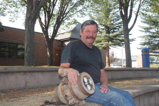 Black Diamond resident Wayne Iversen brightens up old wheel and buggy hubs to create a rustic accent.