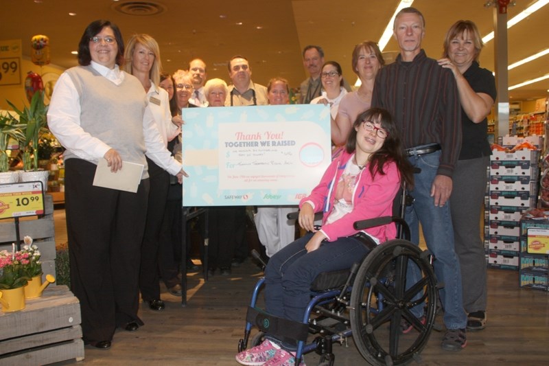 Members of Okotoks Safeway, the Foothills Therapeutic Riding Association and Alexandra Mertens gather for a cheque presentation. Okotoks Safeway gave $1,600 from a Canada 150 