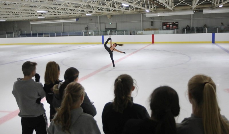 Canadian Olympian and current World silver medallist Kaetlyn Osmond displays her skills for the Okotoks Skating Club at the Murray Arena on Sept. 10 as part of the Be