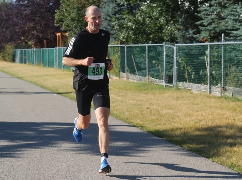 Charles Volsteedt has a clear lead going into the final 100m en route to winning the 39th Sheep River Road Race 10km division Sept. 16 at St. John Paul II Collegiate.