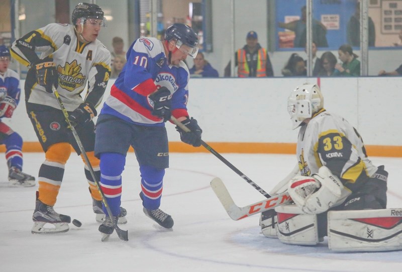 Josh McCulloch goes to the front of the net in search of a rebound during exhibition action between the Okotoks Bisons and Strathmore Wheatland Kings on Sept. 17 in Indus.