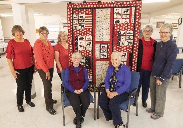 Gail McBride, Beth Stade, Norma Wynne, Lorraine Venechuk, Elinor Melnyk and Maxine Nelson with the Canada 150 quilt they made to be auctioned off at the Pumpkin Patch Tea and 