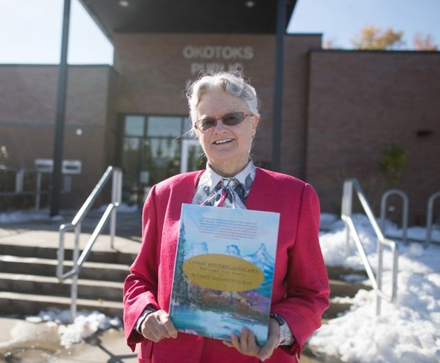 Carol Cowan in front of the Okotoks Public Library on Oct. 4. Cowan is part of the Okotoks Public Library&#8217; s Indie Author Day on Oct. 14.