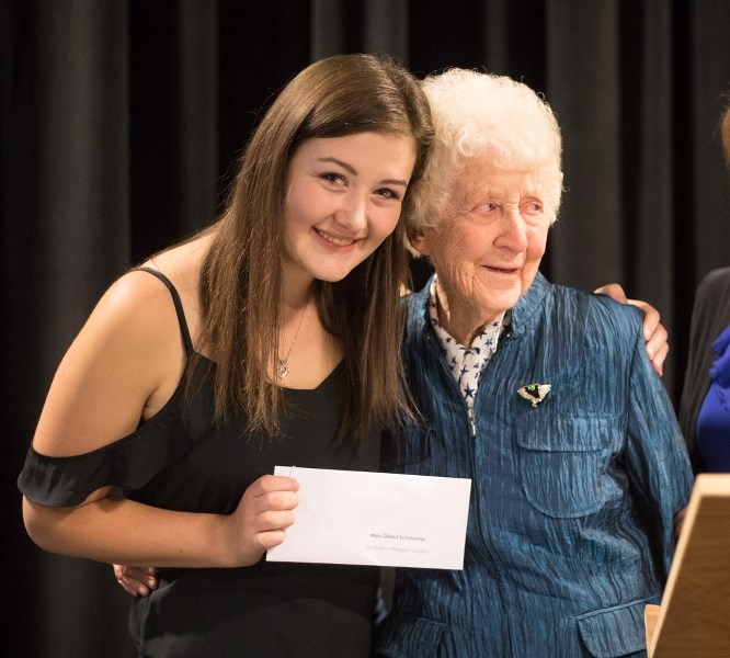 Meagan Quigley hugs her great grandmother Mary Gillard during the Foothills Composite High School&#8217; s awards and scholarship night on Oct. 5. Quigley won the Mary
