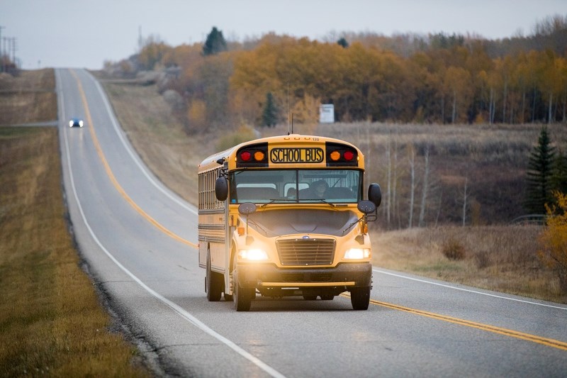 A Foothills School Division bus drives down HWY-552 in the morning on Oct. 13.