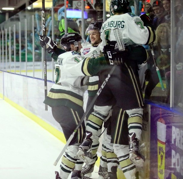 Okotoks Oilers forward Kaleb Ergang is moshed by teammates Zane Kindrachuk, Reece Soukoroff and Nick Blankenburg after scoring a goal in the 3-2 win over Brooks.