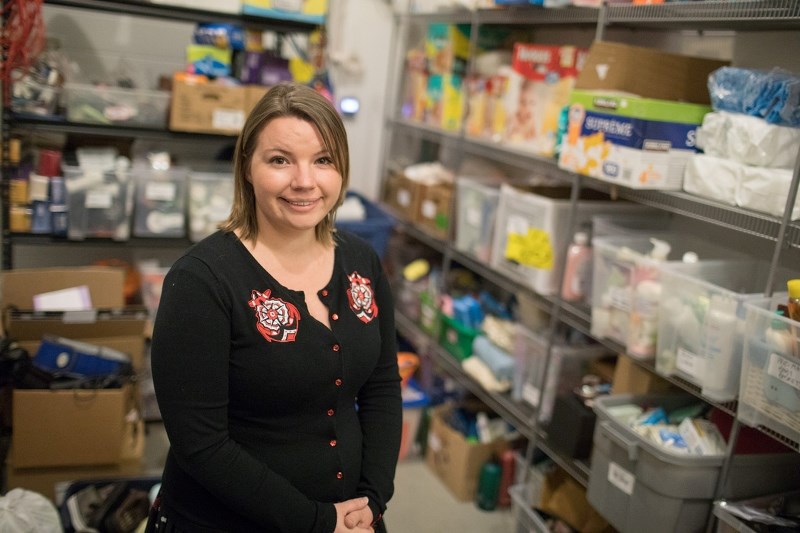 Ally Cramm of Rowan House in their donation room on Oct. 31. Cramm said the shelter relies on community support to cover 40 per cent of its $2.17 million annual budget.