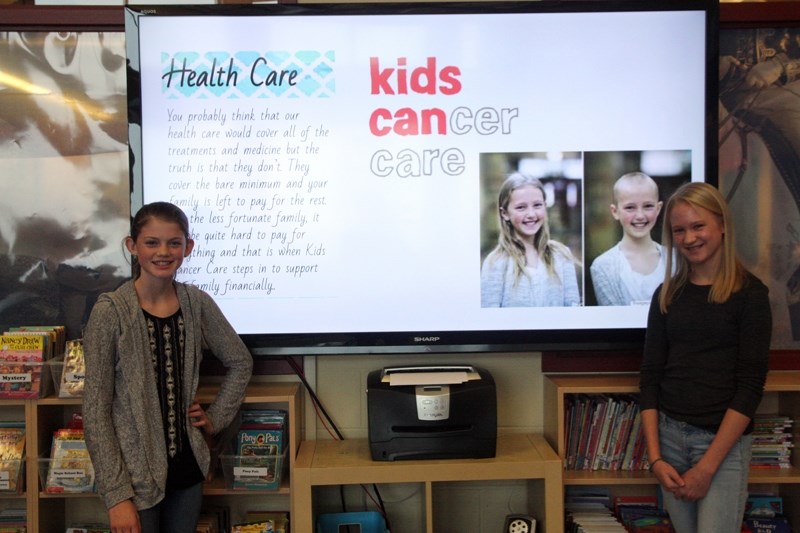 Heritage Heights School Grade 8 students Emma Dunham and Chelsea Taylor promoted Kids Cancer Care as their charity of choice during presentations on Nov. 2.