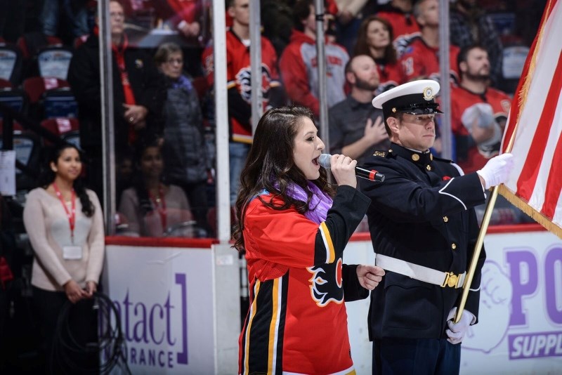Michela Sheedy sings the Canadian and American national anthem at the Calgary Flames-New Jersey Devils on Nov. 5 at the Scotiabank Saddledome.