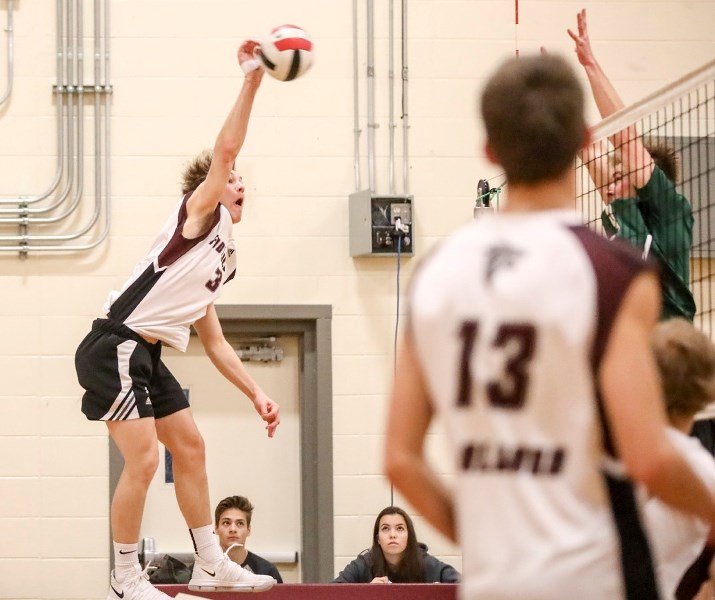 Foothills Falcon Eric Meyer leaps for a big hit versus the Holy Trinity Academy Knights in the 4A South Central Zone final on Nov. 18. The Falcons won in four sets.