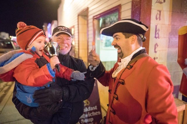 Turner Valley Coun. Barry Crane and Nick Nelson make some noise with Nick&#8217; s grandfather, Terry Myhre, at last year Light Up. This year&#8217; s event takes place Dec.