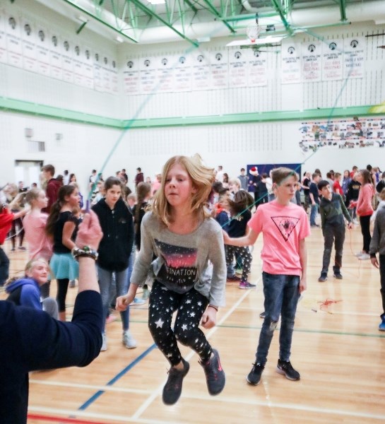 Sixth-grader Sarah Thomas skips rope in the gym at Red Deer Lake School on Dec. 6. Every student in the school poured into the gym to take part in a large-scale skipping
