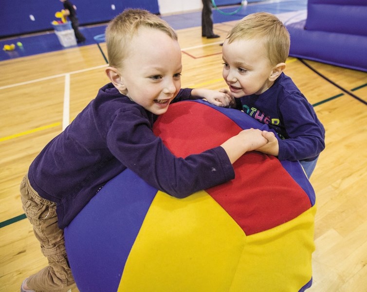 Archie Shearer and brother Charlie play with a large ball during the Kids&#8217; New Years Eve Party at the Okotoks Recreation Centre last year. This year&#8217; s event