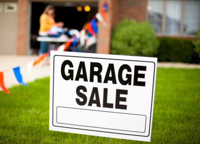 Garage Sale Sign with Woman Shopping