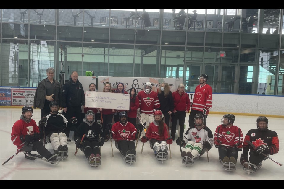 Representatives from Orillia's Canadian Tire presented local sports charity All Sports All People with a $15,000 cheque to continue offering inclusive sports programs for children with disabilities. 