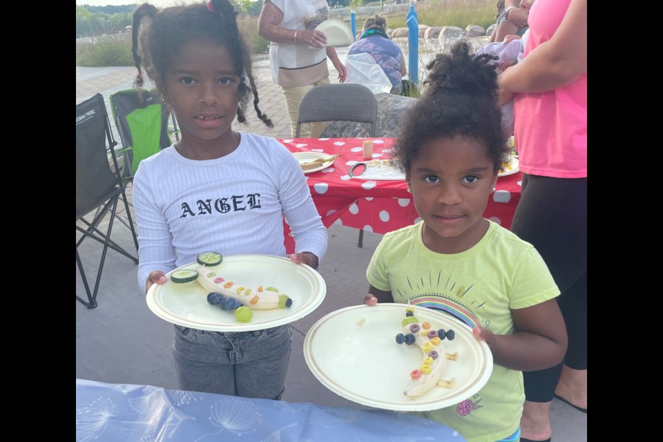 Aubrey, left, and Sophie made 'lady bananas' as part of the City of Orillia and ODAC's 'Eat Your Art' event in Walter Henry Park Wednesday evening.