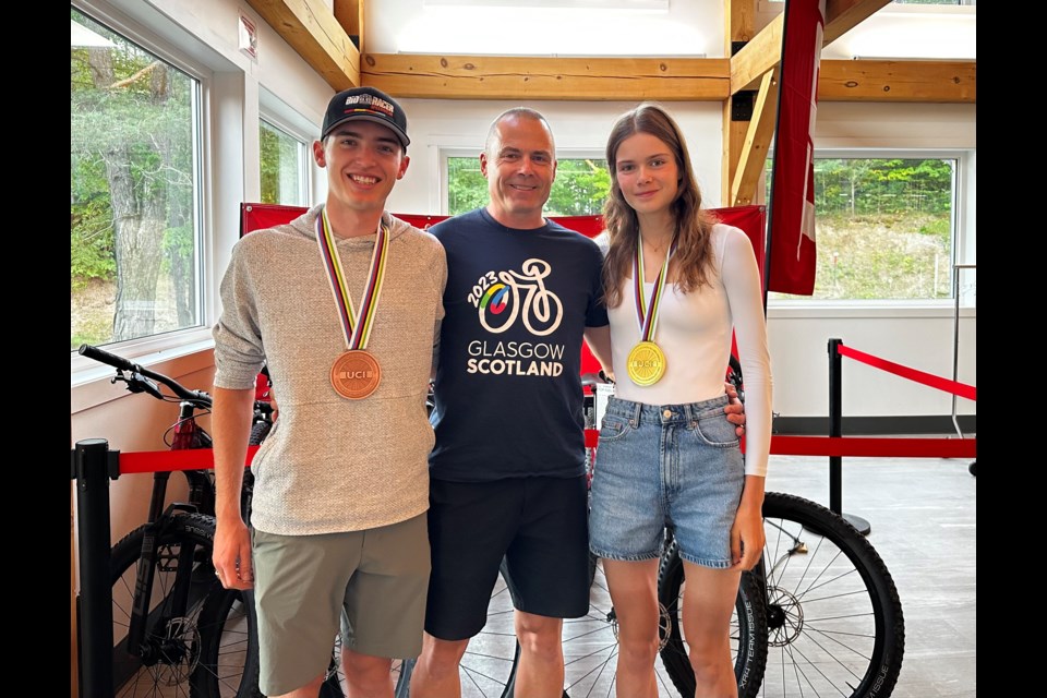 Ian Ackert, coach Rob Holmgren, and Isabella Holmgren were honoured at Hardwood Ski and Bike Wednesday night to celebrate their accomplishments at August’s UCI Cycling World Championship. 