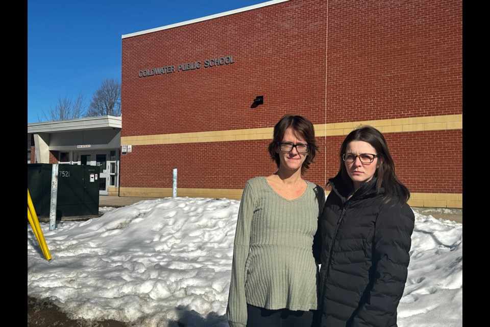 Tori Vivian, left, and Sara Pleasance are among numerous parents concerned with how Coldwater Public School handled an incident Friday afternoon during which a school bus was shot with a pellet gun while children were aboard. Greg McGrath-Goudie/OrilliaMatters