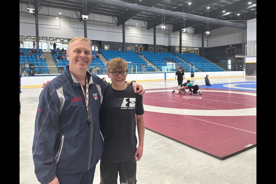 For the first time in four years, the city-wide youth wrestling tournament is back in Orillia. City championship organizer Juris Ligers is pictured here with bantam competitor Alex Harbridge following the student's win. 