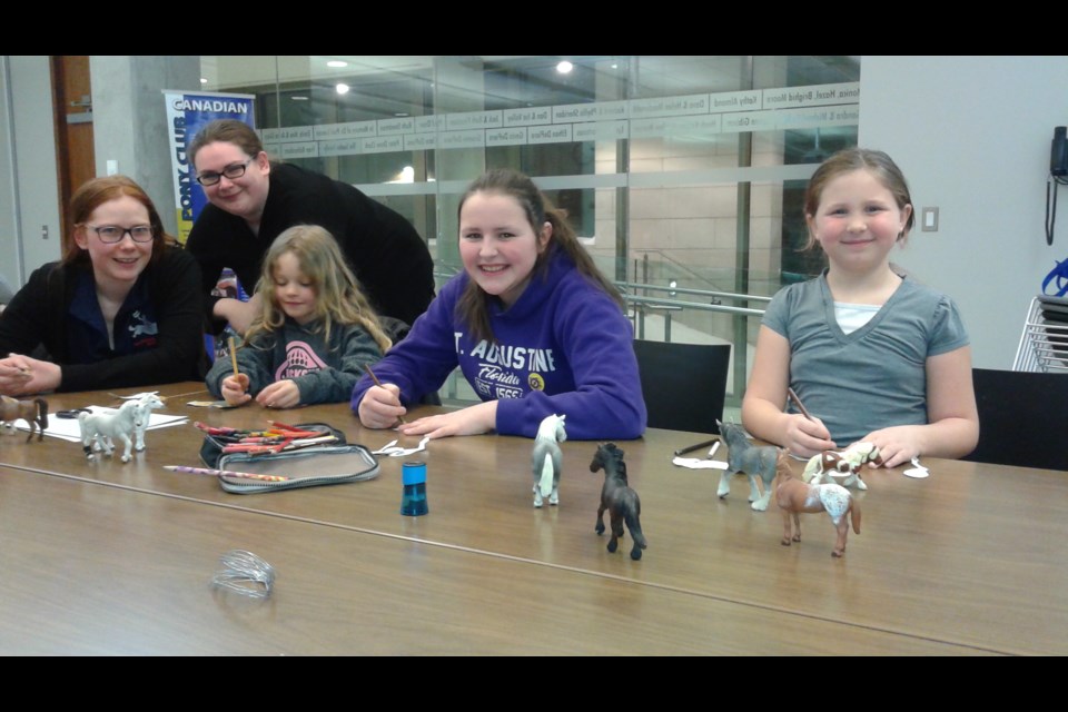 Members of the Horseshoe Pony Club gather at the Orillia Public Library . The next meeting is March 20. Contributed photo