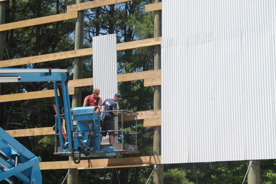 Workers construct a new screen at the Muskoka Drive-In Theatre in Gravenhurst. Contributed photo
