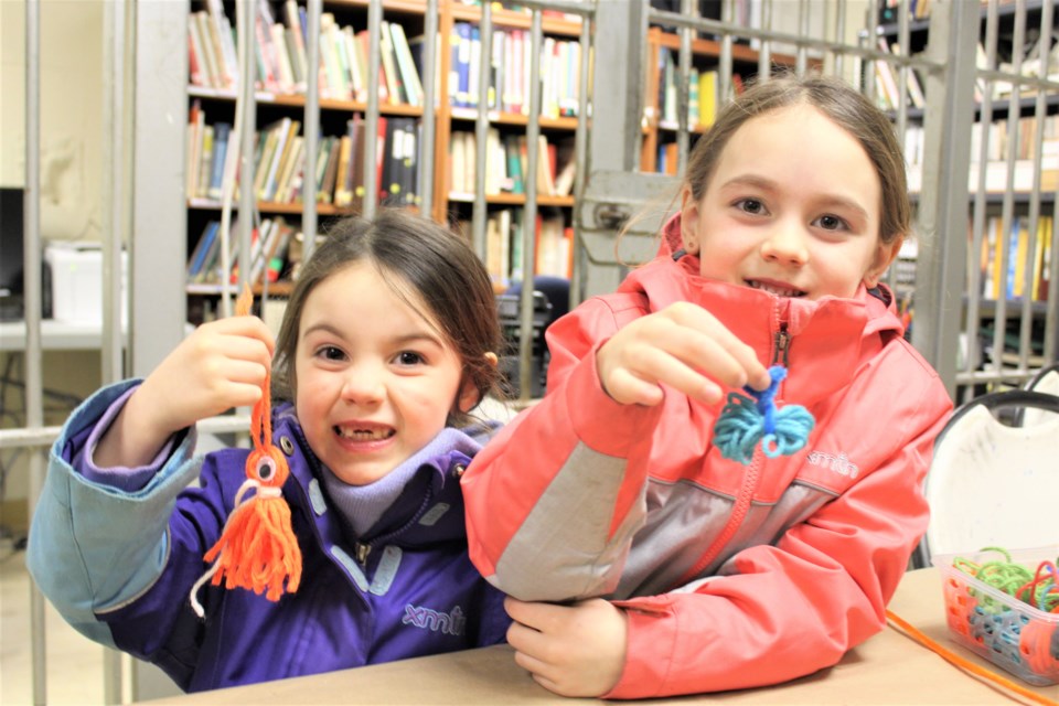 Elena Ellison, left, 4, and her sister, Avery Ellison, 7, show off their creations Sunday during Fibre Fun Day at the Orillia Museum of Art and History. Nathan Taylor/OrilliaMatters