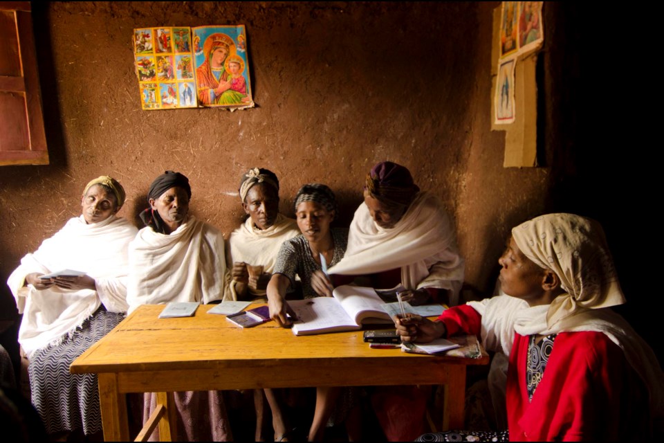 Investors talk over finances at locally managed Women’s credit bank in Ethiopia. Photo by Philip Maher          