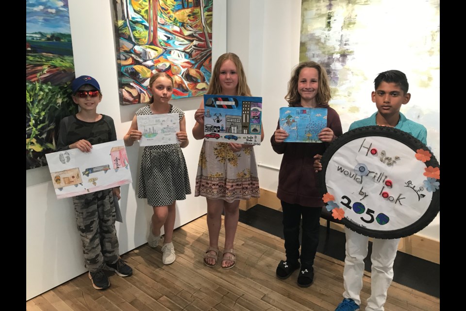 The elementary school winners of Sustainable Orillia's art contest are shown during an event Friday at Creative Nomad Studios.