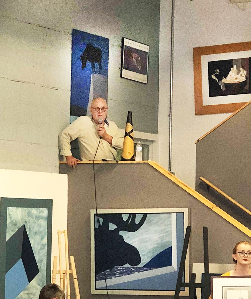 Charles Pachter on the mic at a previous in person auction 2018