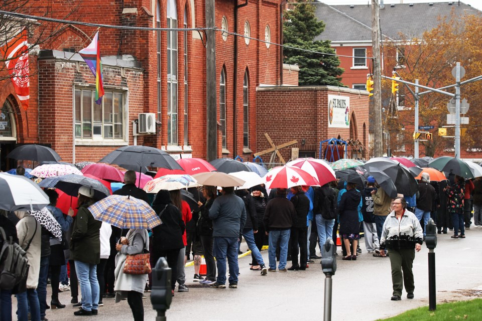 People line up in the rain for the public visitation for Gordon Lightfoot at St. Paul's Centre in Orillia on Sunday. | Kevin Lamb for OrilliaMatters