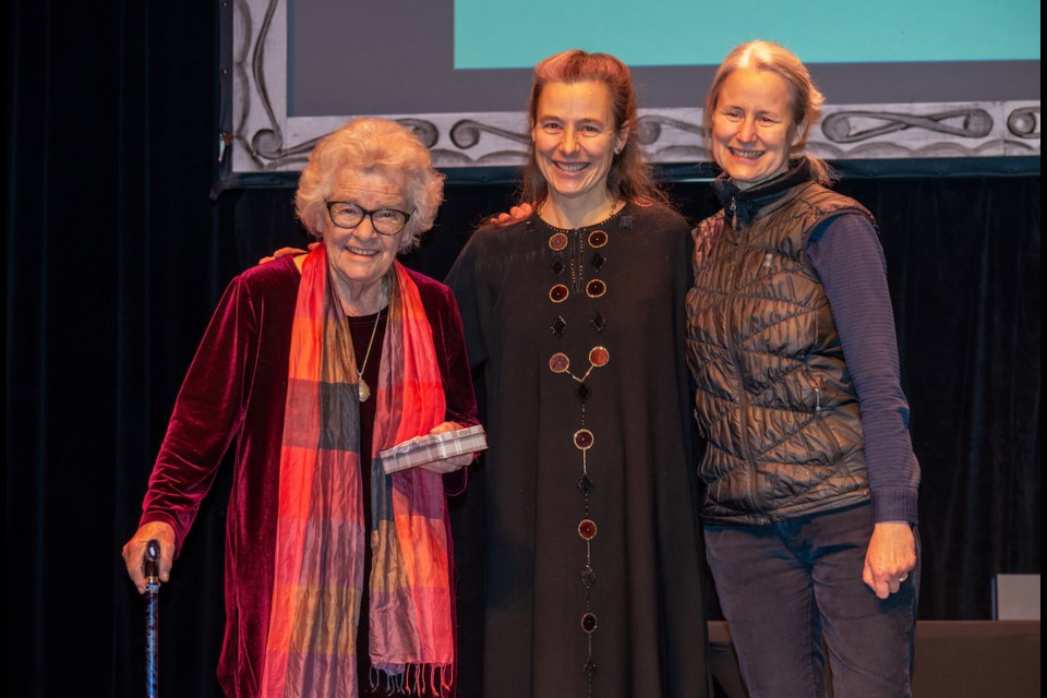 Doreen Uren Simmons, left, accepts the Qennefer Browne Achievement Award from Browne's daughters Sydney and Nigama during the Orillia Regional Arts and Heritage Awards gala on Wednesday evening. 