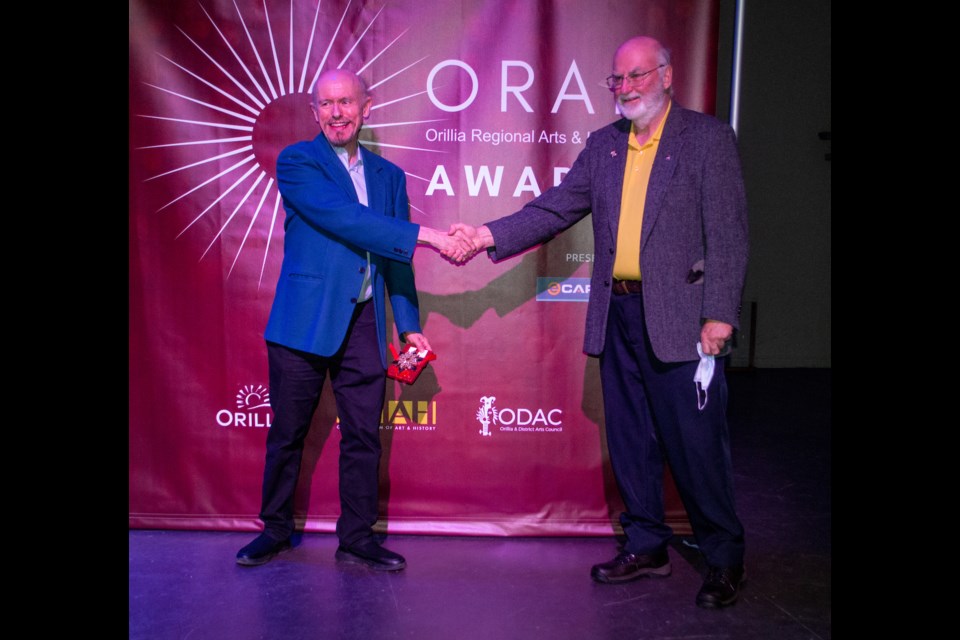 Blair Bailey received the Qennefer Browne Achievement Award from Ted Duncan, President of Orillia Museum of Art & History.
