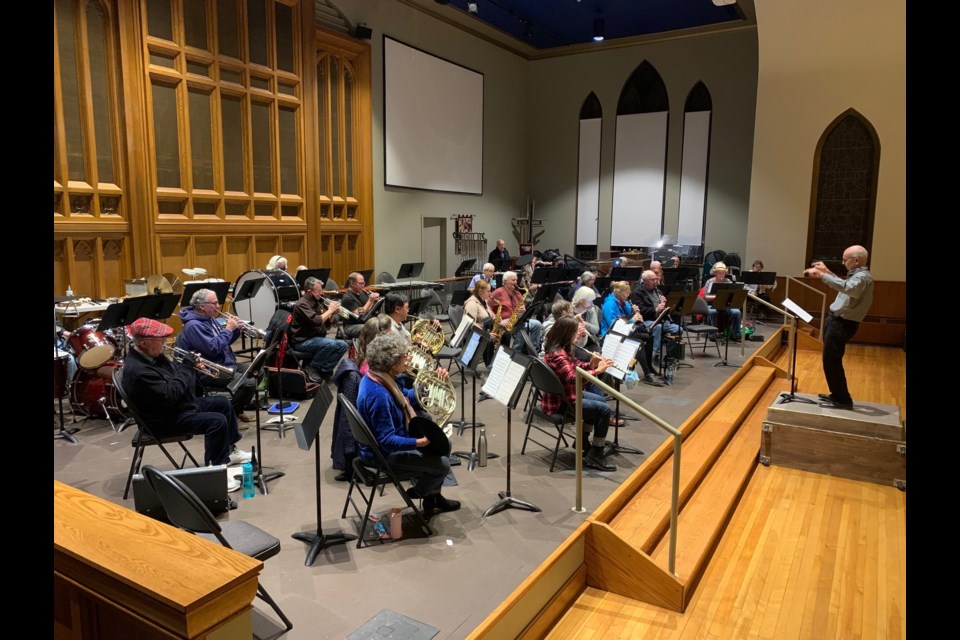 Randy Hoover conducts a rehearsal of the Orillia Concert Band earlier this week as they prepare for their Christmas concerts.