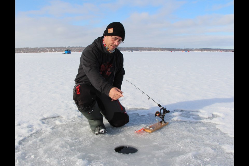 Father, son hooked on new addiction: ice fishing - Barrie News