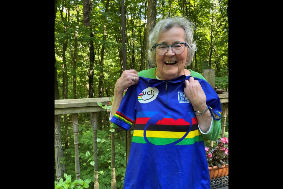 Local cycling champion, Ann Budge, shows off one of her coveted jerseys representing her achievement at world masters mountain biking championships.