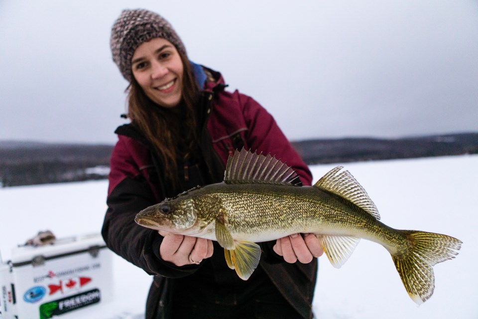 Shannon Lane proudly shows off one of the walleye she caught during a girls’ weekend away.