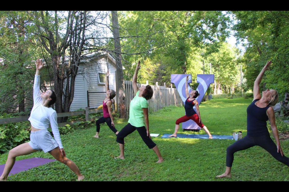 Extended warrior is a favourite pose by this group practicing with instructor Sue Sinclair. Kathy Hunt/OrilliaMatters