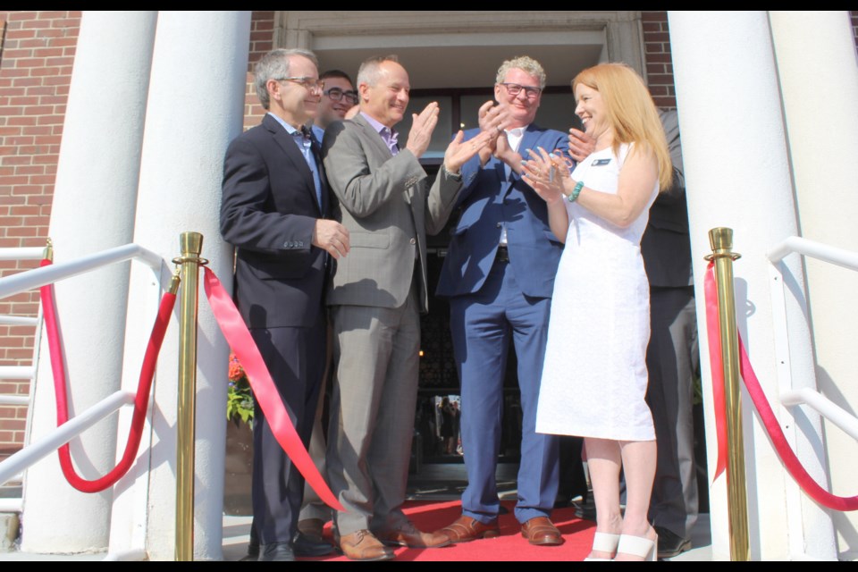 Applause as the ribbon is cut Tuesday during the grand opening of the Champlain Waterfront Hotel. From left: Simcoe North MP Bruce Stanton, Coun. Mason Ainsworth, Choice Hotels Canada president Brian Leon, Mayor Steve Clarke and hotel manager Jacquie Jibb. Nathan Taylor/OrilliaMatters