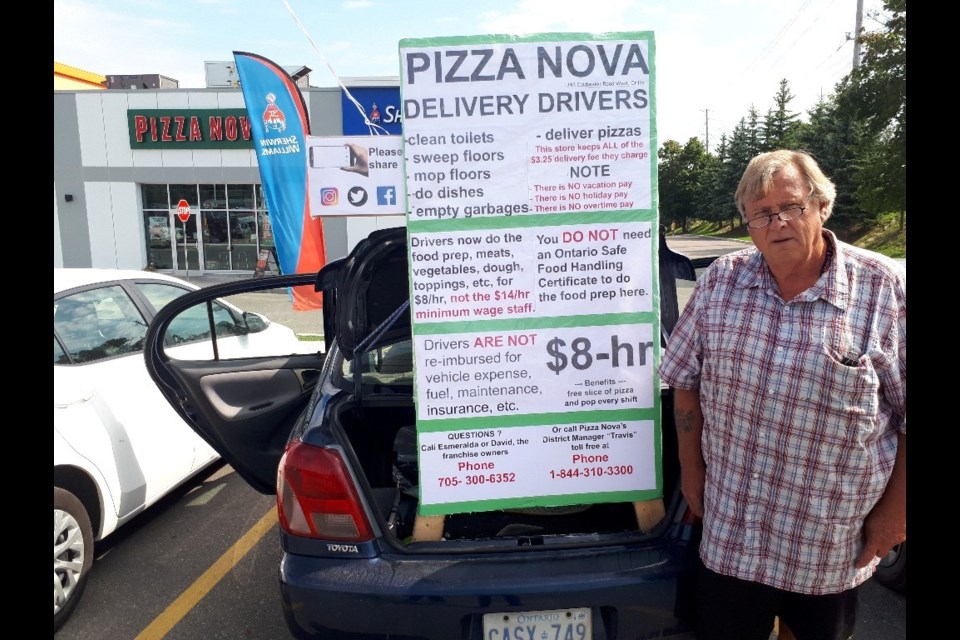 Murray Smith is furious that Pizza Nova paid pizza delivery drivers like him far less than minimum wage by classifying them as contract workers – something he says is illegal. He has taken his protest public and set up outside the eatery before being threatened with a trespassing charge. Now he has taken his mobile protest across the street to the Tim Hortons. 