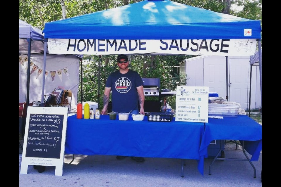 Luke Hewitt, owner of Swine and Dine, is shown at the Orillia Farmers' Market. Supplied photo