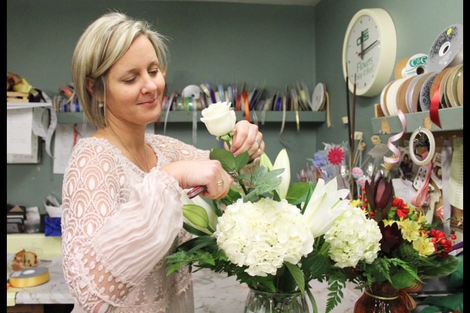 Evans Flowers owner Sandra Wink works on an arrangement. Nathan Taylor/OrilliaMatters