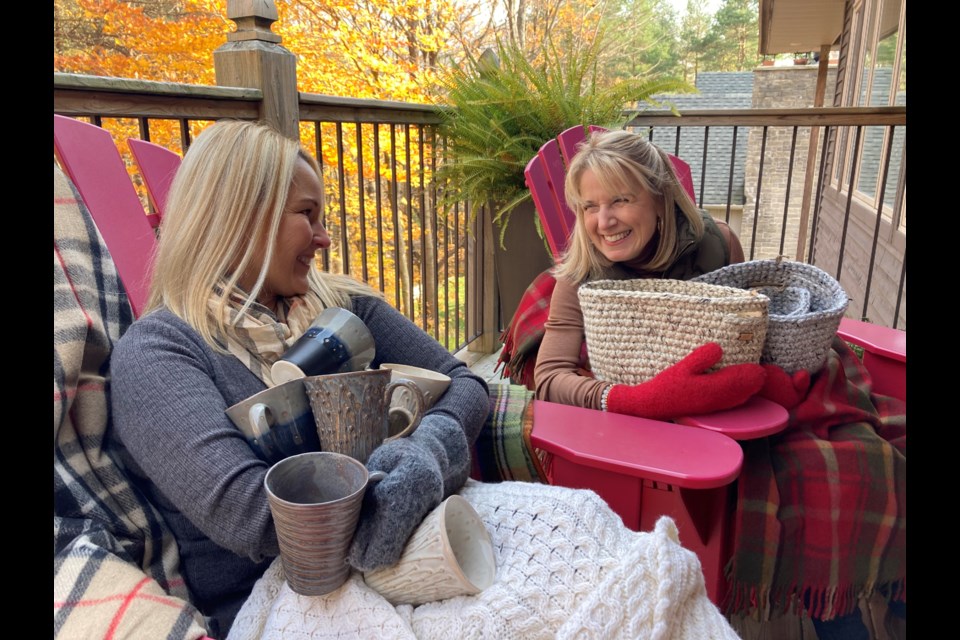 Paula Beech and Deanna Langill sit outside with some of their favourite Handpicked products. Sam Gillett/OrilliaMatters