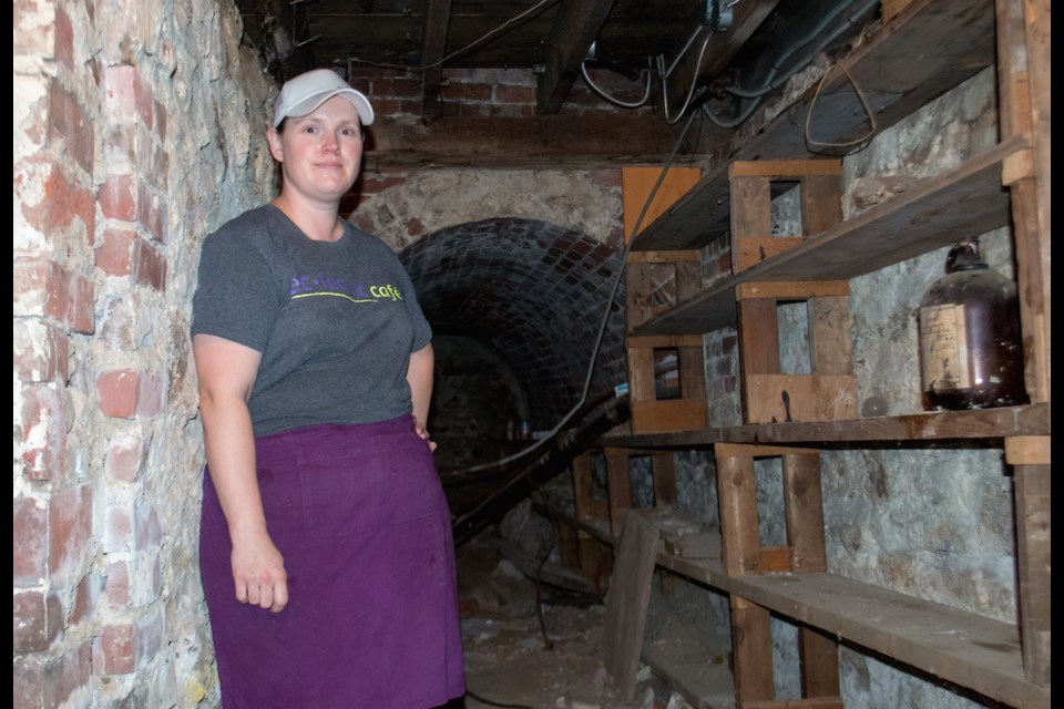 Eclectic Café owner Melanie Robinson stands in front of the brick tunnel that lies below her downtown business. When Robertson first moved into the historic location, she experienced some strange happenings in the 'creepy' space. Tyler Evans/OrilliaMatters