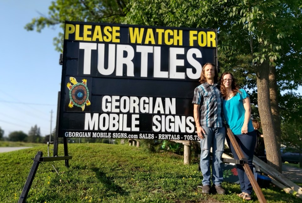 Mike Mather (left) with his wife Trish Burke (right)