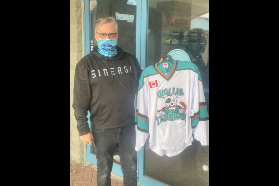 Rick Sinotte, owner of Sinergy Clothing, says Orillia Minor Hockey Association coaches could face discipline if their athletes wear apparel from certain companies.