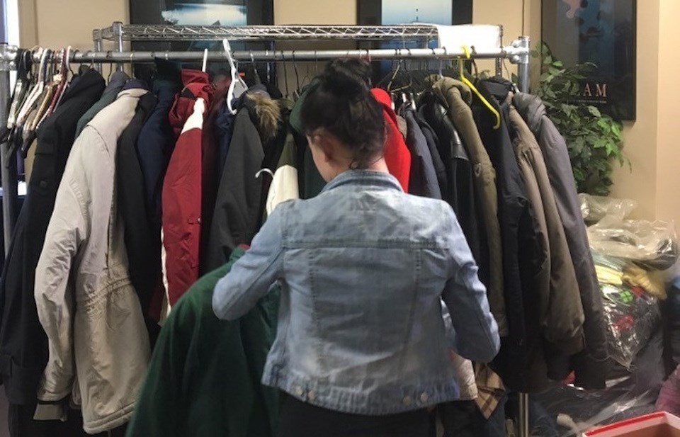 A volunteer organizes donated coats at the Orillia Learning Centre as part of the 8th annual Winter Coat Drive. Supplied photo