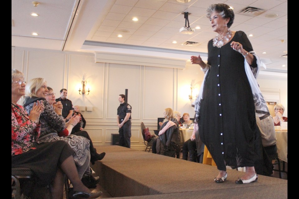 Three-time cancer survivor Beverley Wise models apparel and accessories from Just Elaine's during Thursday night's Daffodil Fashion Show at Hawk Ridge Golf and Country Club. Nathan Taylor/OrilliaMatters