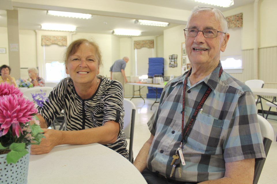 Rhea Whalen, a volunteer at St. James' Anglican Church, is pictured with Rodney Dobson, who often attends the weekly Loonie Lunch. Nathan Taylor/OrilliaMatters