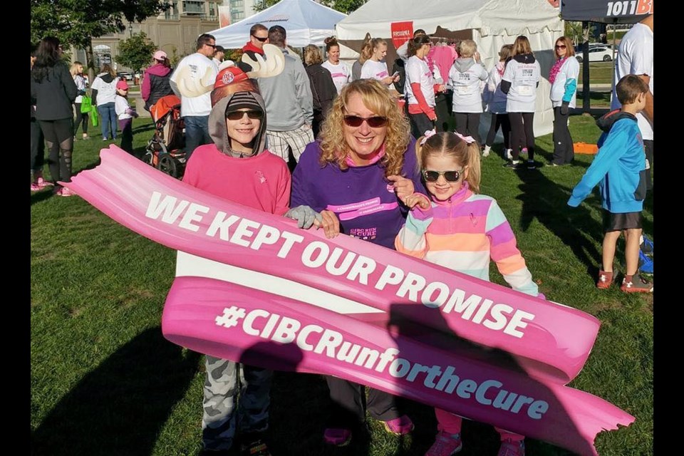 Shelley Irwin, centre, is the director of the Barrie/Orillia CIBC Run for the Cure and is a breast cancer survivor. Supplied photo