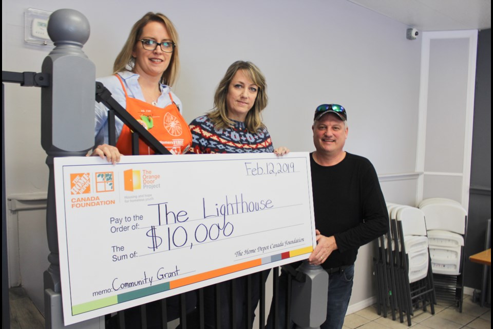 The dining room at the Lighthouse in Orillia has received a facelift thanks to a $10,000 grant from the Home Depot Canada Foundation. On hand for a cheque presentation Tuesday were Tammy Irwin, left, manager of Home Depot's Orillia store, Lynn Thomas, development co-ordinator with the Lighthouse, and Dave Rimkey, vice-president of R&F Construction. Nathan Taylor/OrilliaMatters